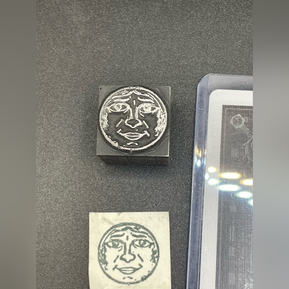 Father Moon Antique Typeset Carved in Metal and Mounted on Wood